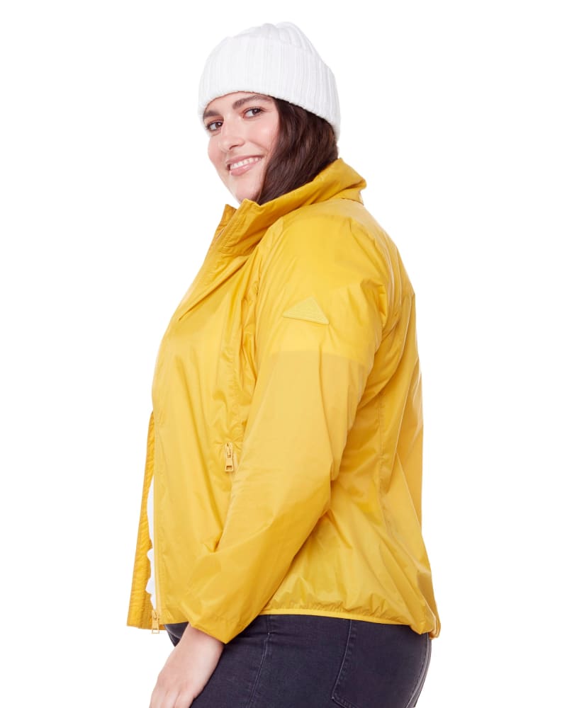 Side of a model wearing a size 3X Ultralight Windshell Jacket in YELLOW by Alpine North. | dia_product_style_image_id:279157